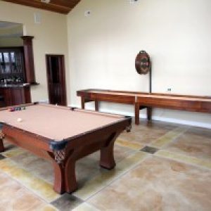 Gameroom Shot Antique Brunswick Arcadia Pool Table and McClure Handcrafted Shuffleboard