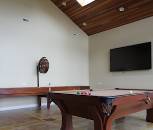 Spacious attic shuffleboard table gameroom desgins